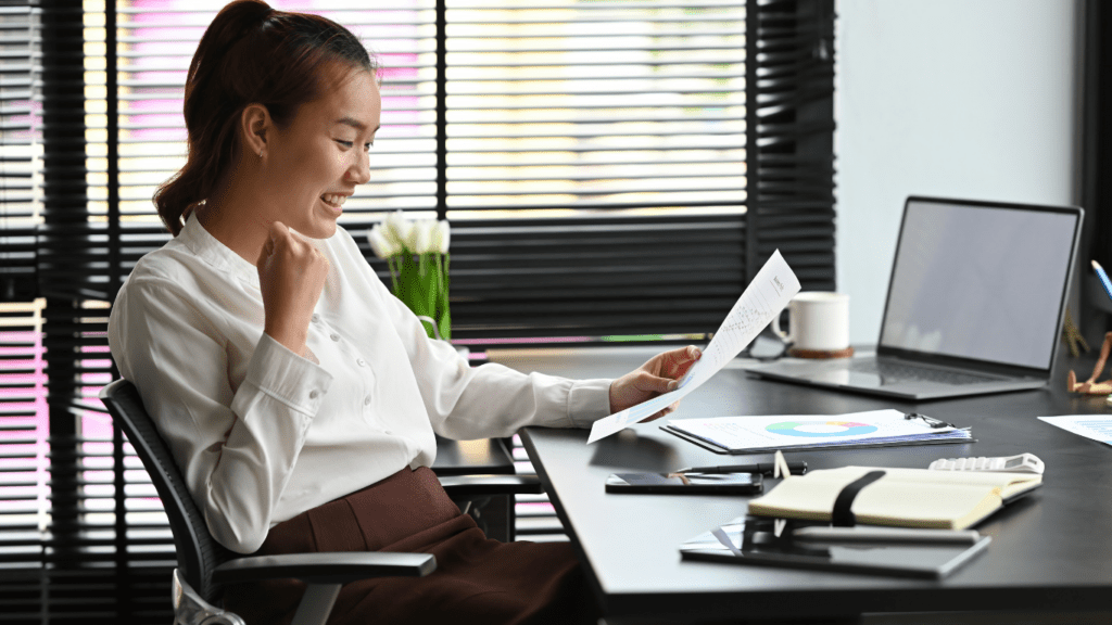 A person sitting at a desk with a laptop