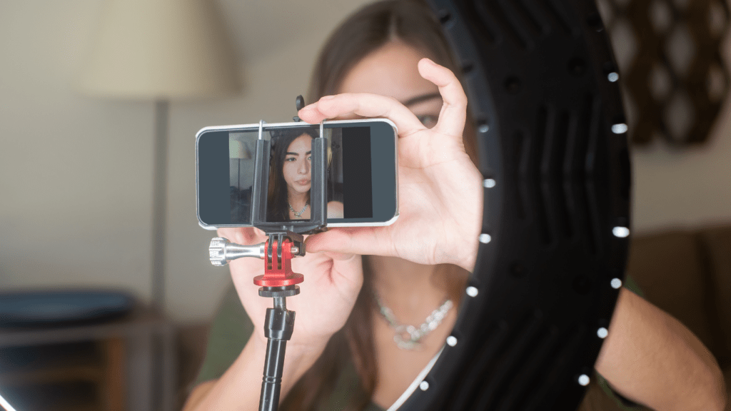 A person sitting with a ring light