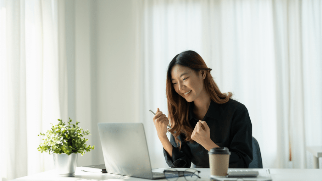 A person sitting at a desk with a laptop