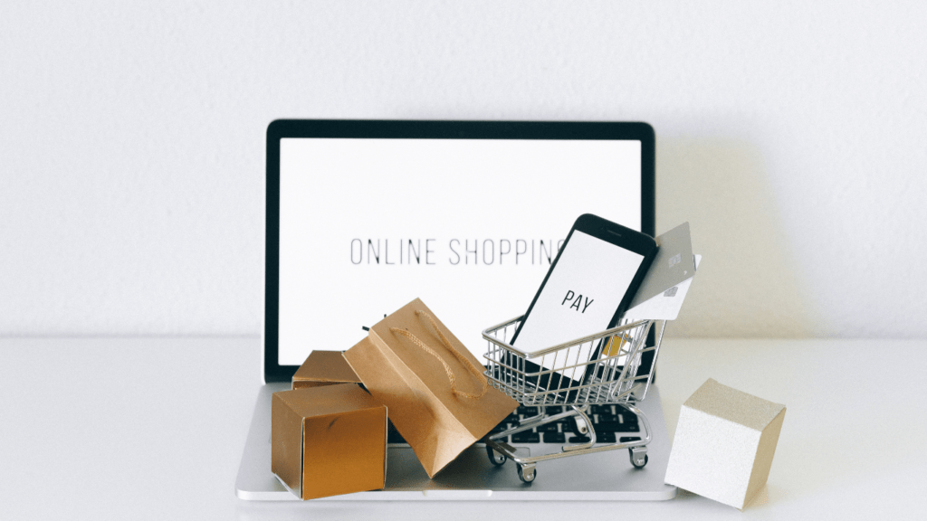 a person sitting at a desk with a shopping cart in front of them