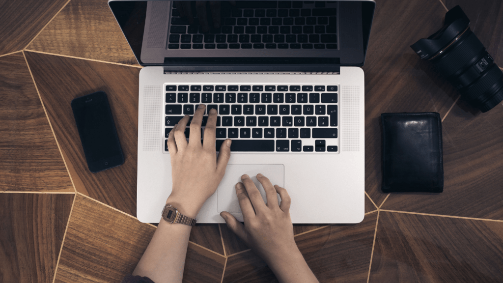 a person typing in computer