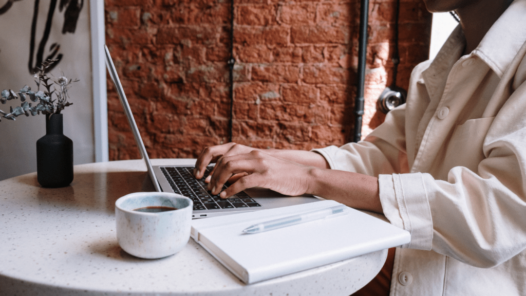 a person typing in computer